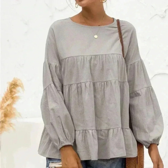 Tops - - Tiered top. Size Medium